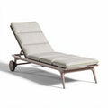 Outdoor adjustable lounge chair with fabric cushioning and wheels in beige